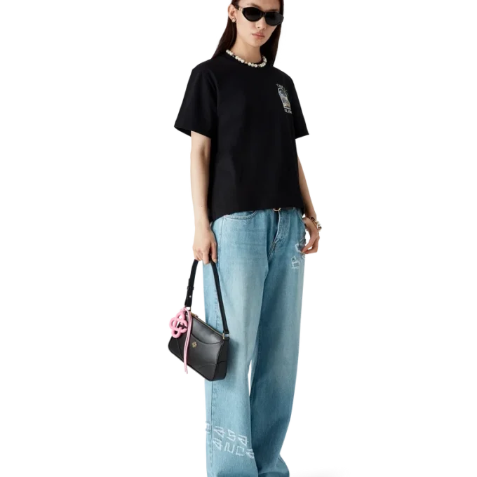 Calças de ganga com efeito desgastado e grafite