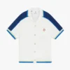Camisas de croché de calções branca e azul Camisas de croché de calções branca e azul