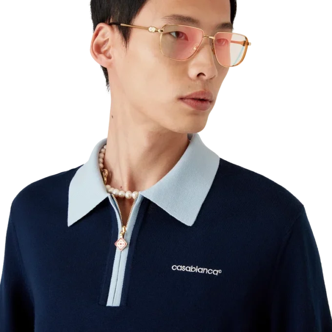 Polo de ténis em malha de lã merino